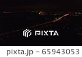 4K Aerial. Night City  cars traffic highway with fires over night river and bridge 65943053