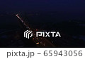 Aerial. Night City highway with car traffic and  bridge over river. Lateral fly  65943056