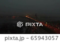 Aerial. Night City highway with car traffic and  bridge over river. Lateral fly  65943057