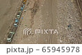 The vehicle and people working the garbage dump, garbage truck drop trash on the landfill for the excavator and people sorting garbage 65945978