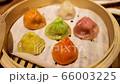 Colorful steam dimsum close up inside the wooden box in Chinese restaurant 66003225