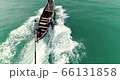 Chasing fishermen in canoe full speed 66131858