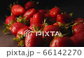 Strawberry on black background slow motion side view. Delicious ripe juicy red berries on table closeup. Fresh strawberries with stalk natural eco pure fruit. Summer sweet organic product slow mo 66142270