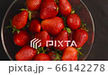 Strawberry on black background slow motion side view. Delicious ripe juicy red berries on table closeup. Fresh strawberries with stalk natural eco pure fruit. Summer sweet organic product slow mo 66142278