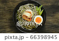 Soba Noodles with Shrimps served Boiled Egg in shoyu soy sauce Soup Japanese Food Fusion Style sprinkle white sesame and seaweed decorate leek topview 66398945
