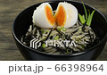 Soba Noodles with Egg and shoyu soy sauce Japanese Food Fusion Style sprinkle white sesame and seaweed decorate spring onion sideview 66398964