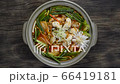 Spicy Oysters Soup with Kimchi Korean Food Style (Guljigae) refreashingly clear in pot decorate with leek topview 66419181