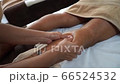 massage the back of the lower leg with two hands massage the back of the lower leg with two hands 66524532