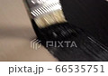 Stock Footage: Painting a board with a brush 66535751