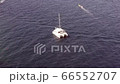 Catamaran boat sailing off Pacific coast of Cabo Baja California, aerial view 66552707