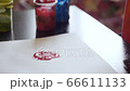 Happy little girl with hands in red paint drawing 66611133