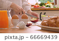 Close up woman is cutting apple on table in the kitchen,salad and healthy breakfast. 66669439