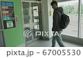 young man who is waiting for elevator on the parking lot or station 67005530