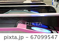 People pass through the automatic metro fare point in Tokyo, Japan 67099547