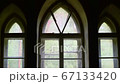 Gothic style windows of an abandoned castle close-up. Video fullHD panorama 67133420