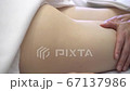Close up of woman therapist massaging the feet of her patient in spa salon Close up of woman therapist massaging the feet of her patient in spa salon 67137986