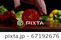 Preparing tomato on kitchen to cook healthy lunch. Vegetarian food from organic products.  67192676