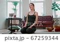 Attractive Young Yoga Trainer Start Online Training at Home using Mobile Gadget. 67259344