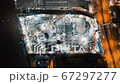 Time-lapse of under construction site, crane, and car traffic transportation in Asian city at night 67297277