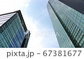 Shinbashi, Tokyo Japan, June26, 2020, Look up view 4K video footage of Tokyo high rise, skyscraper in Business and financial area, with panning shot  from left to right and blue sky cloudy background. 67381677