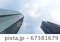 Shinbashi, Tokyo Japan, June26, 2020, Look up view 4K video footage of Tokyo high rise, skyscraper in Business and financial area, with panning shot  from left to right and blue sky cloudy background. 67381679