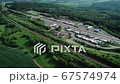 German highway, rest area and highspeed train railroad track - aerial view 67574974