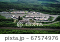 German highway, rest area and highspeed train railroad track - aerial view 67574976