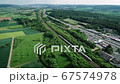 German highway, rest area and highspeed train railroad track - aerial view 67574978