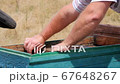 Apiarist Near the Hive 67648267
