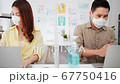 Asian business people wear face mask, greeting with elbow bump, wash hand using hand sanitizer 67750416