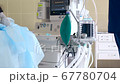 Close-up of a ventilator during an operation, FullHD shot. The movement is remembered by artificial lung ventilation, amid a ward with a patient and doctors. Pneumonia and tuberculosis, Covid 19 67780704