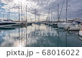 sailboats in a marina. Reflection in water the passing of clouds 68016022