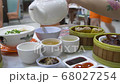 pouring tea at dim sum 68027254
