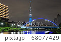 [タイムラプス]世界難民の日・特別ライティングのスカイツリーとふれあい橋の夜景(ズームイン) 68077429