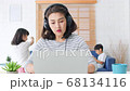 Asian mother work at home with kids playing and dancing in living room 68134116