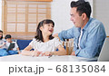Asian parents homeschooling their children at home 68135084
