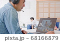 Asian father video call conference, online meeting with business coworker with family in living room 68166879