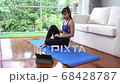As asian girl haing yoga exercise alone in living room in her house 4k 68428787