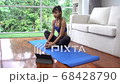 As asian girl haing yoga exercise alone in living room in her house 4k 68428790