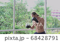 A caucasian boxer practice boxing alone in living in his house 4k 68428791