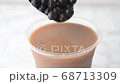 tapioca pearls splashing into milk tea 68713309
