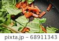 Stir-fried vegetable cooking scene 68911343