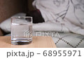 tablet dissolves in water, and on the background a man tossing and turning 68955971