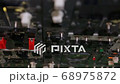 Close up on the controls on a passenger airplane with pilot flipping some switches. 68975872