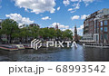 Time lapse of Amsterdam cityscape with view of canal in Netherlands. 68993542