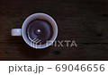 Coffee on wood background top view. 69046656