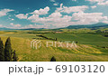 Beautiful and miraculous colors of green spring panorama landscape of Tuscany, Italy. Sunny morning near Pienza. Aerial view  69103120
