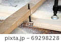 Slow Motion. Sawing a piece of wood with a jigsaw 69298228