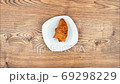Stop Motion One delicious croissant on a plate 69298229