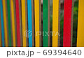Wooden fence made of boards of different colors 69394640
